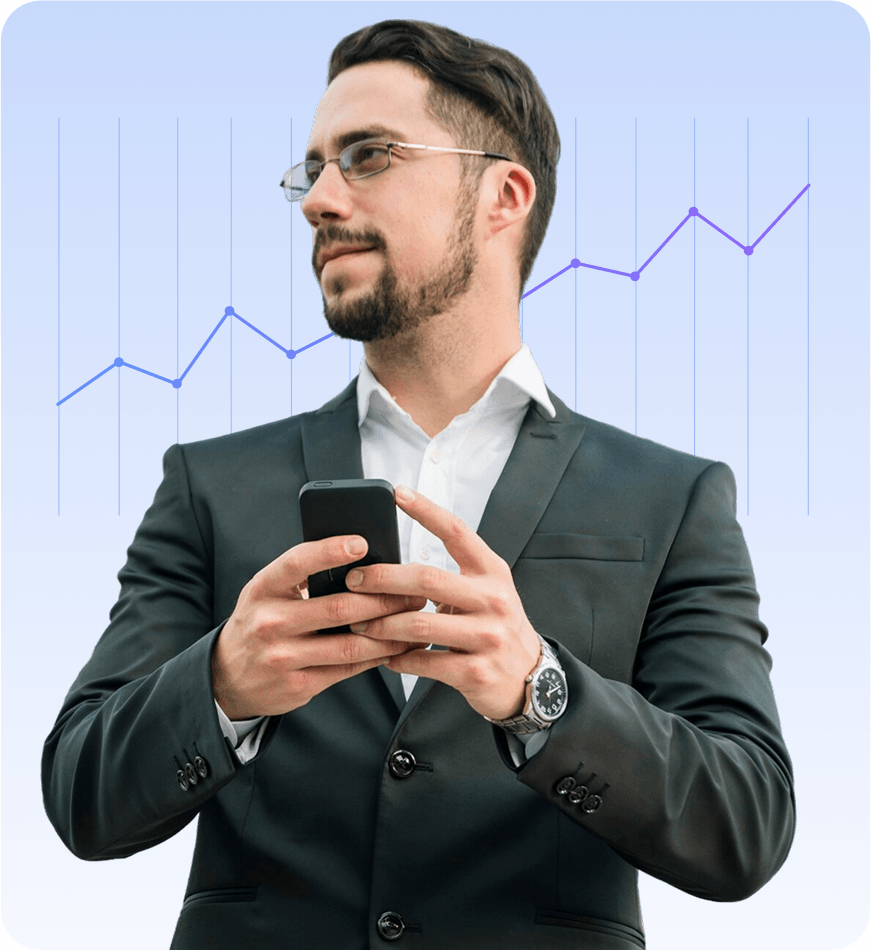 A sharply dressed businessman in a suit holds his smartphone while standing in front of a rising line chart on a blue gradient background, suggesting mobile data analysis.
