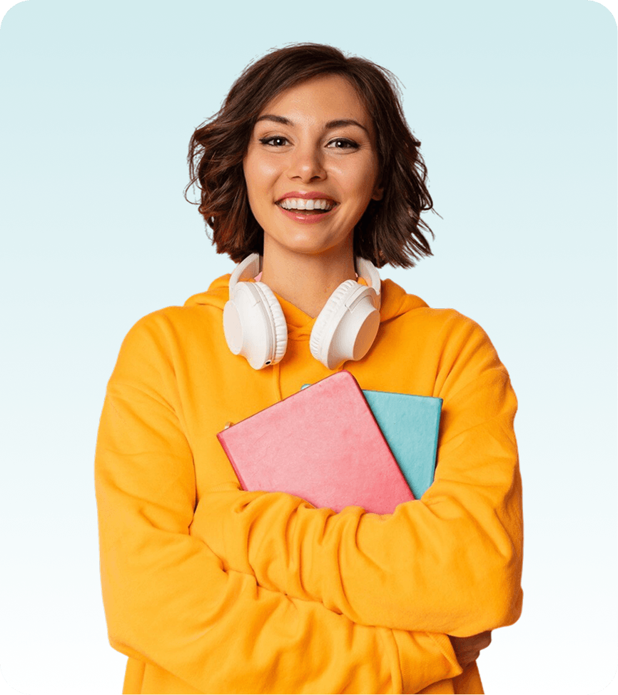 A smiling young woman in a bright yellow hoodie stands against a light blue background, holding two notebooks and wearing white over-ear headphones around her neck.