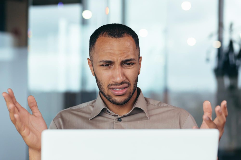 man in business meeting frustrated with microsoft teams lagging
