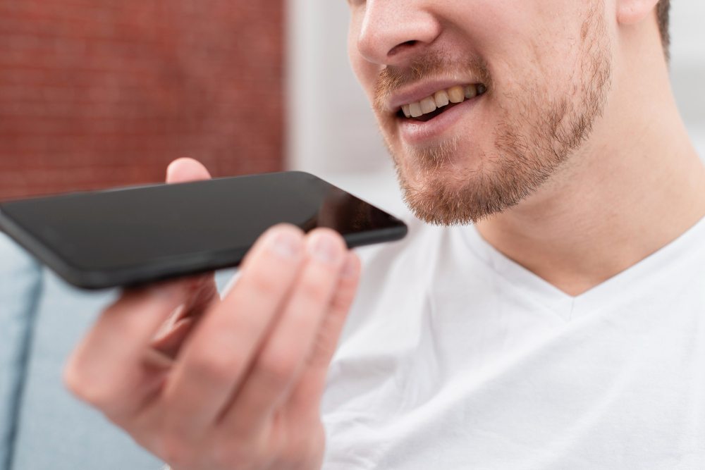 man recording voicemail greeting