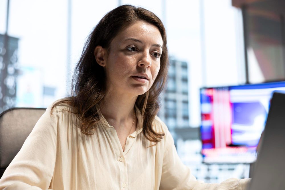 woman at office troubleshooting teams cache issues