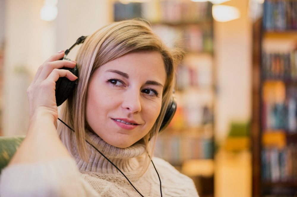girl using headphones to listen to audio translation
