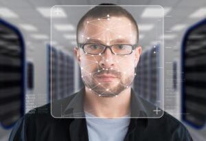 AI facial recognition software scanning a person's face with overlay graphics