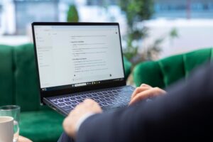 man talking with chatgpt on laptop