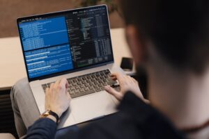 dev coding ai app on laptop