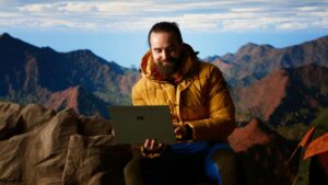 designer with laptop using best ai tool for images