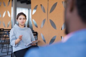researcher checking interview transcription on laptop