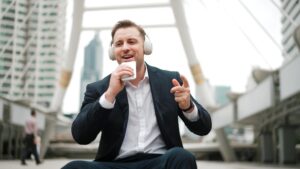 man using phone for voice to text dictation