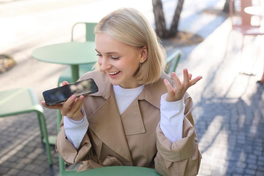 girl talking into iphone mic